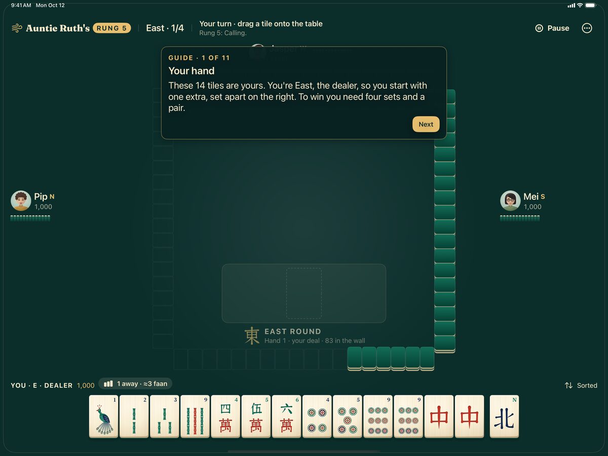 The iPad guided hand explains four sets and a pair above a row of readable mahjong tiles.